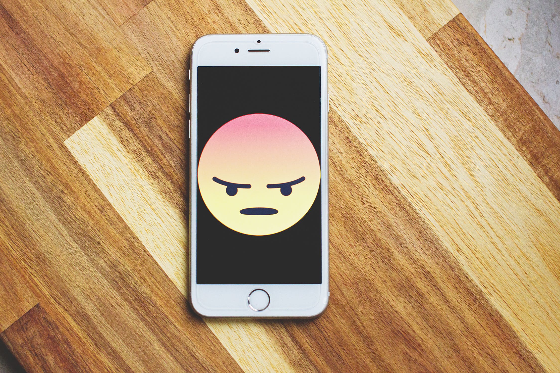 Angry emoji on an iphone screen